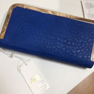 Blue clutch with gold trim